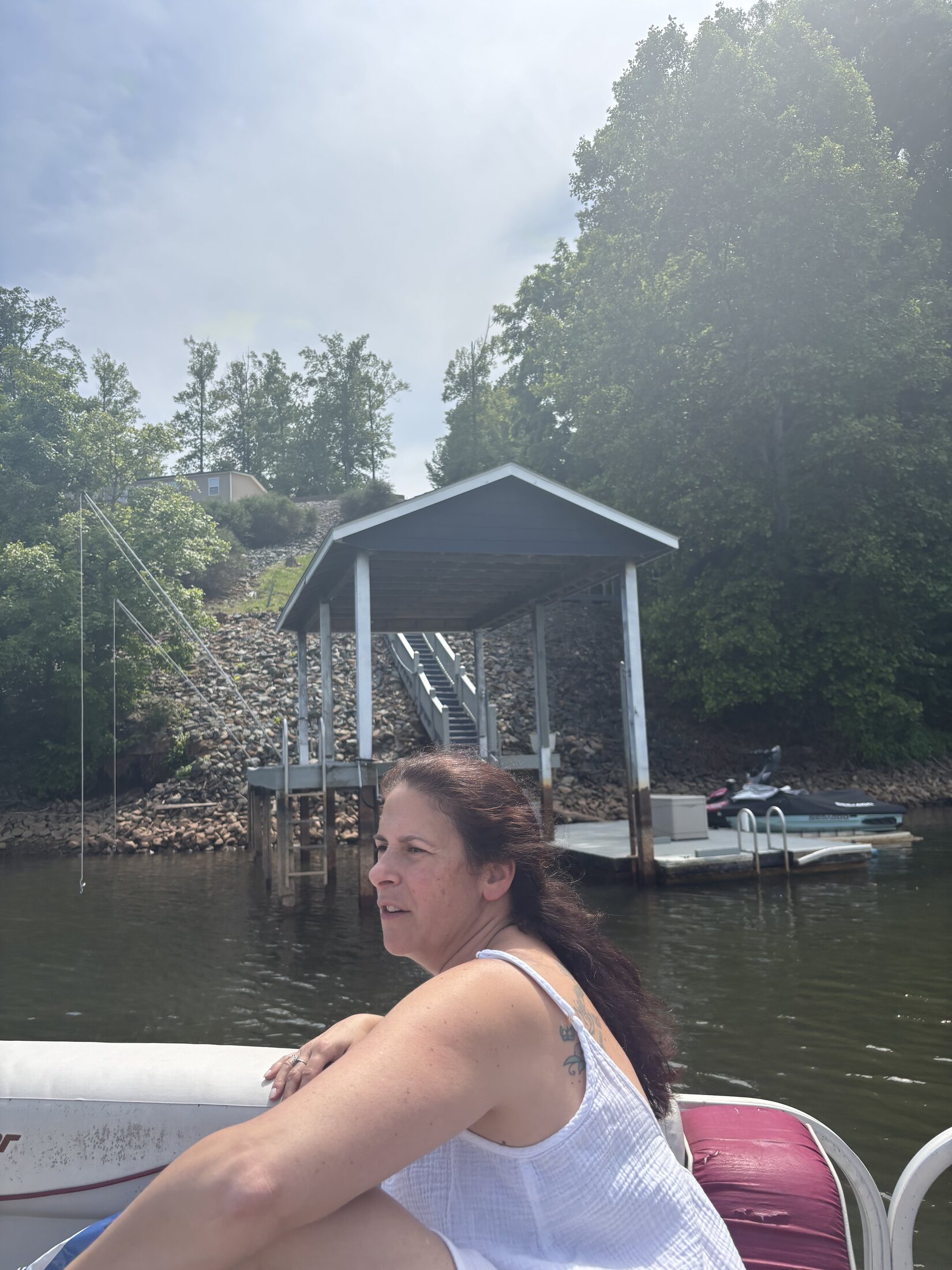 The lakefront boathouse before the finished Bokenko Lake Retreat sign was installed