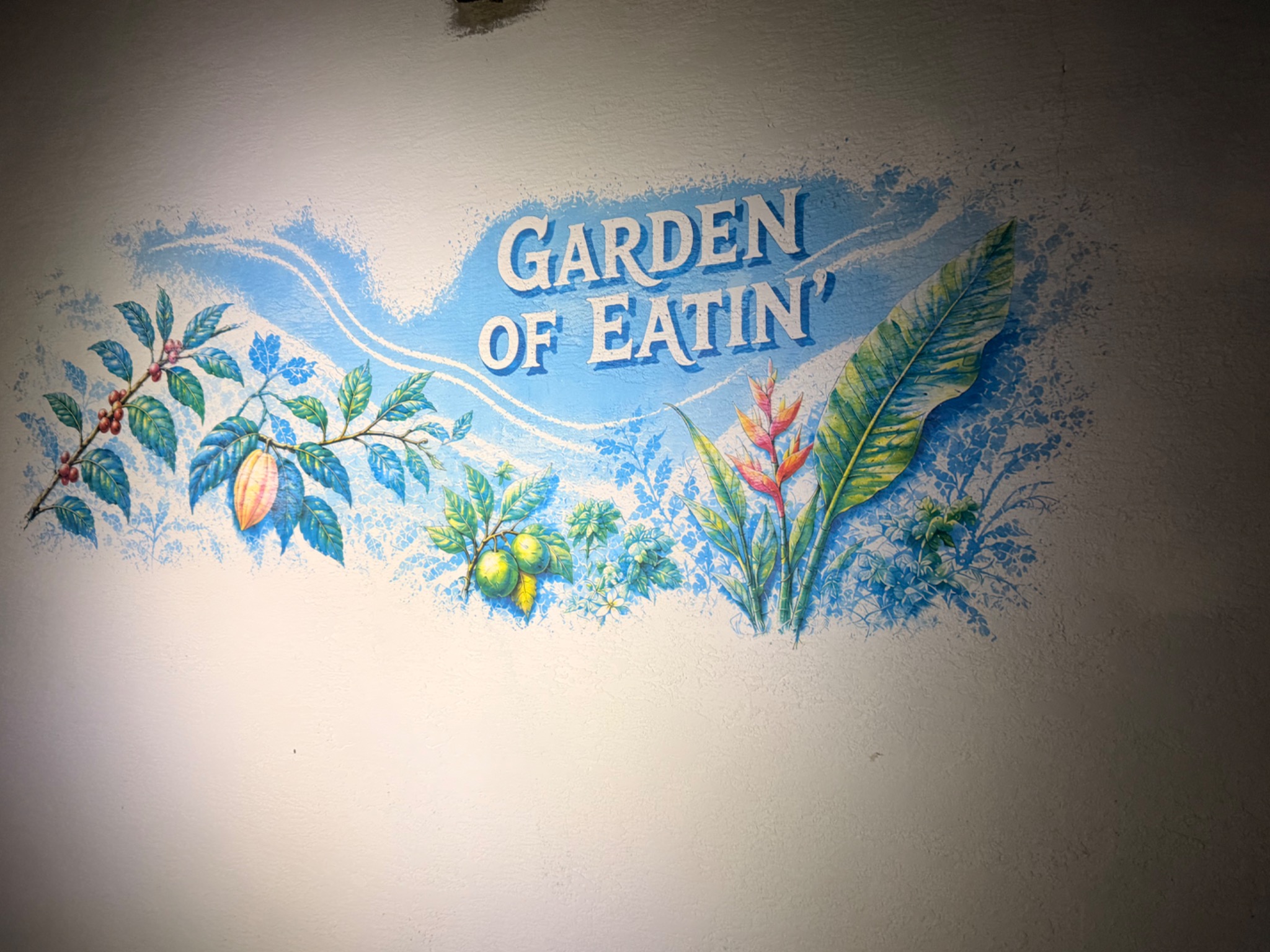 Completed Garden of Eatin’ artwork under exterior lighting at Krust Café